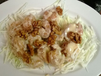 Honey Glazed Walnut Shrimp: lightly breaded, deep fried shrimp tossed in a mayonnaise based glaze served under a bed of cabbage and topped with honey glazed walnuts.