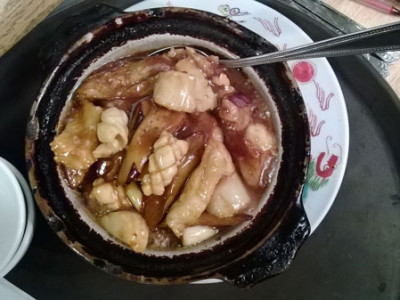 Seafood Eggplant Hot Pot: eggplant, shrimp, scallops, squid and fillets of flounder cooked in a dark brown garlic sauce.